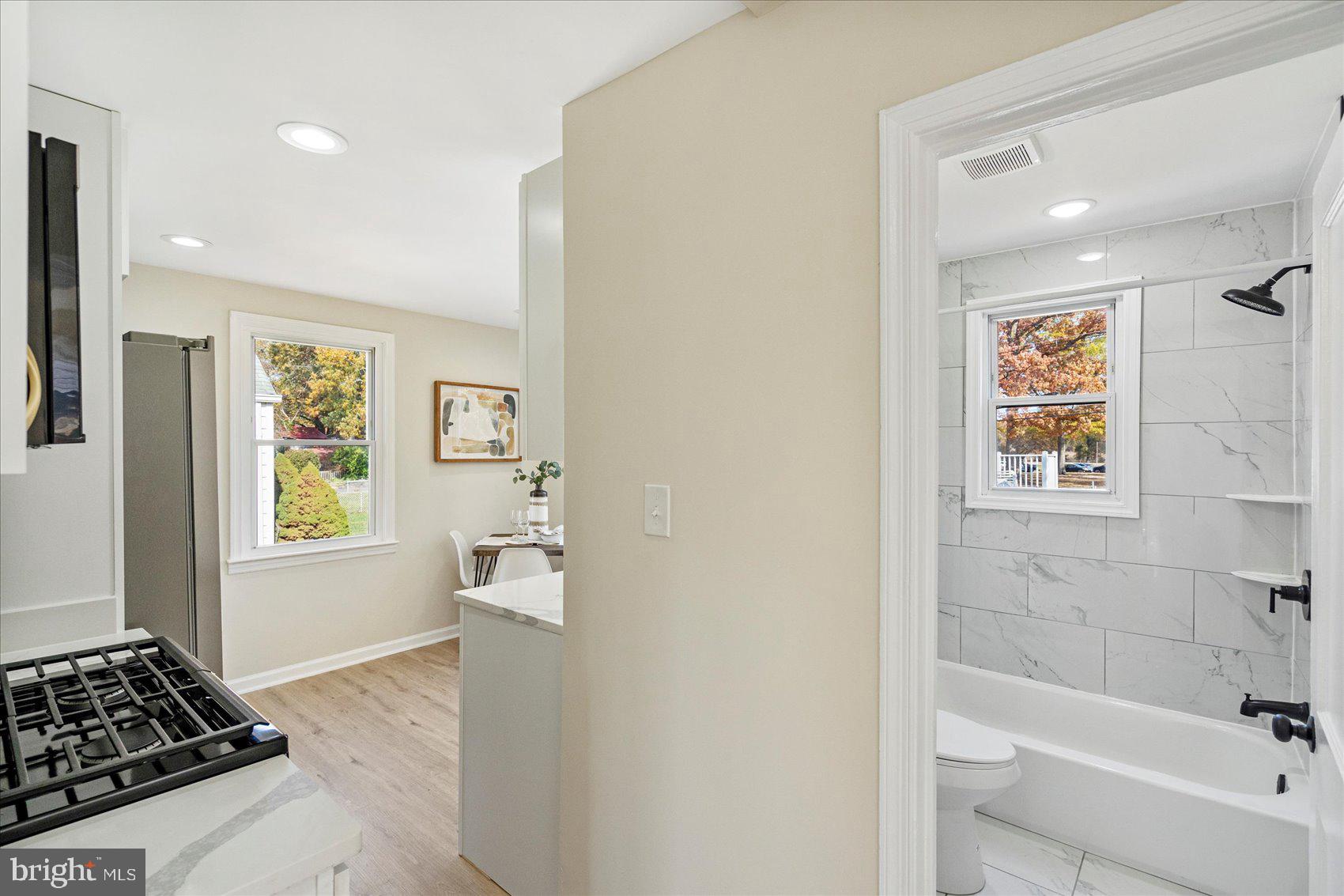 405 Margaret Avenue Baltimore, MD 21221 - Photo 15 of 38 a bathroom with a bathtub and a shower