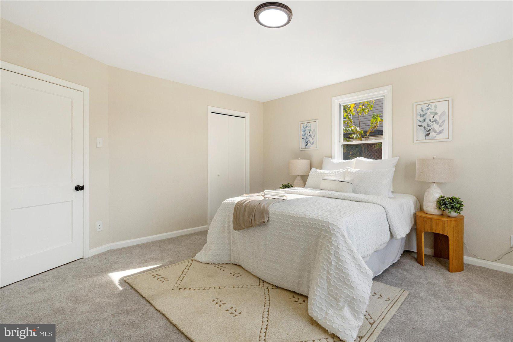 405 Margaret Avenue Baltimore, MD 21221 - Photo 20 of 38 a bedroom with a bed and painting on the wall