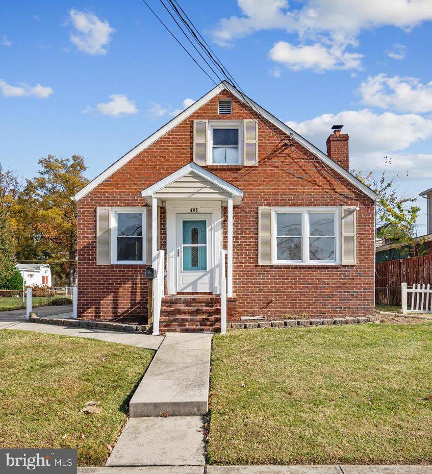 405 Margaret Avenue Baltimore, MD 21221 - Photo 2 of 38 a front view of a house with a yard