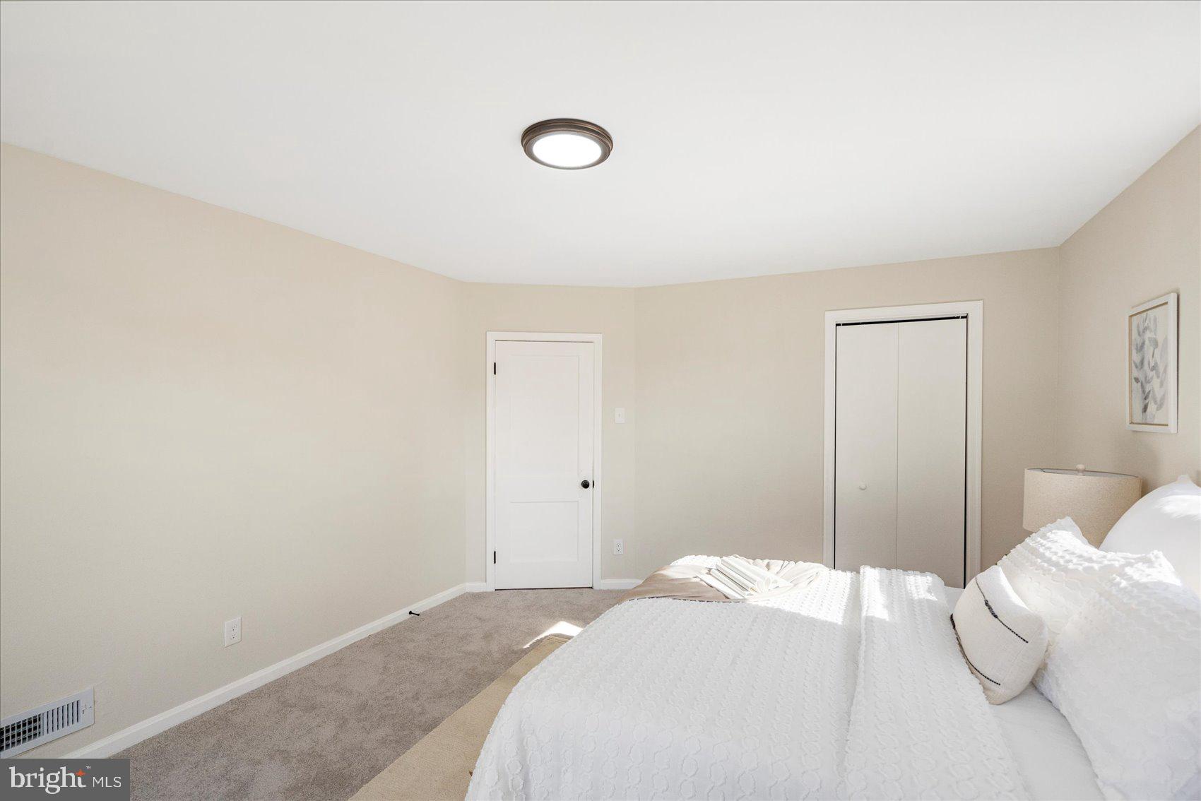 405 Margaret Avenue Baltimore, MD 21221 - Photo 21 of 38 a bedroom with a bed and a night stand