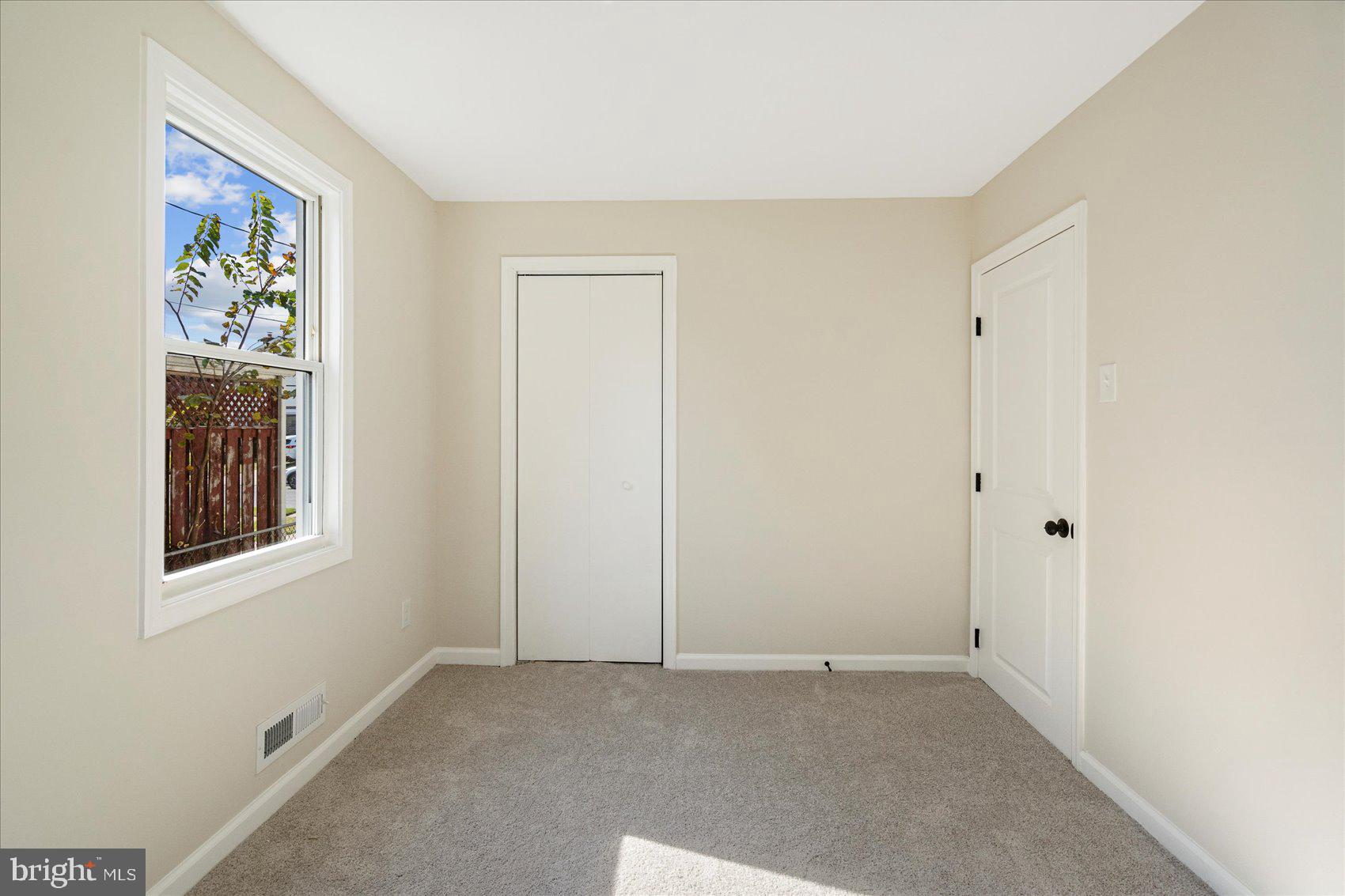 405 Margaret Avenue Baltimore, MD 21221 - Photo 23 of 38 a view of an empty room with a window