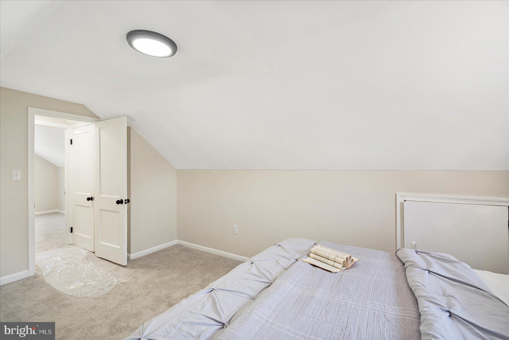 405 Margaret Avenue Baltimore, MD 21221 - Photo 25 of 38 a bedroom with a bed and cabinets