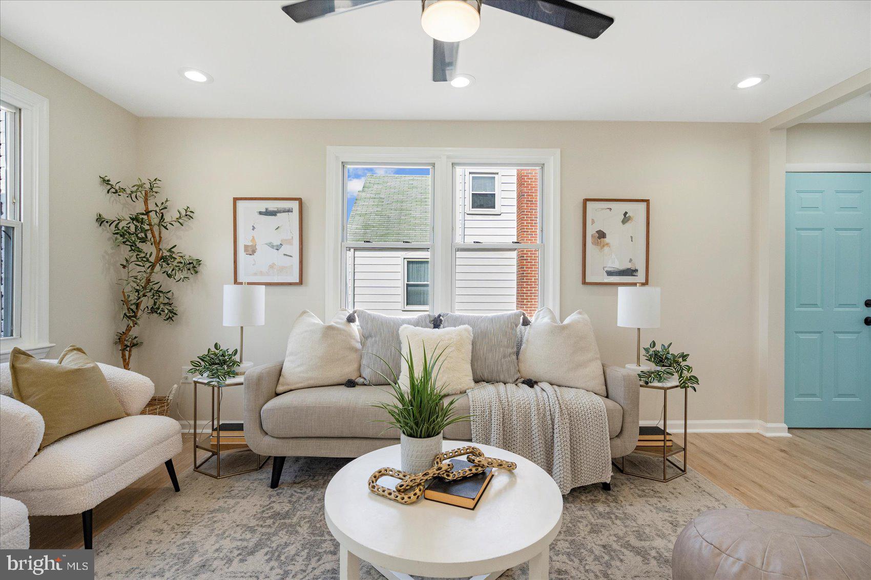 405 Margaret Avenue Baltimore, MD 21221 - Photo 3 of 38 a living room with furniture and a large window