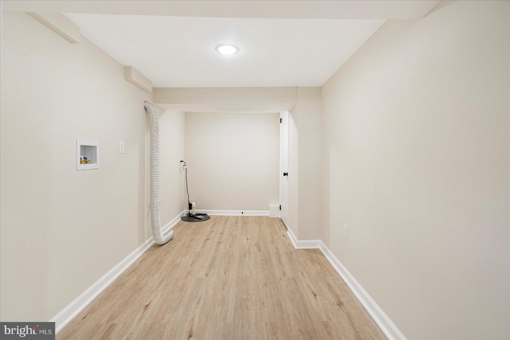 405 Margaret Avenue Baltimore, MD 21221 - Photo 31 of 38 a view of an empty room with wooden floor
