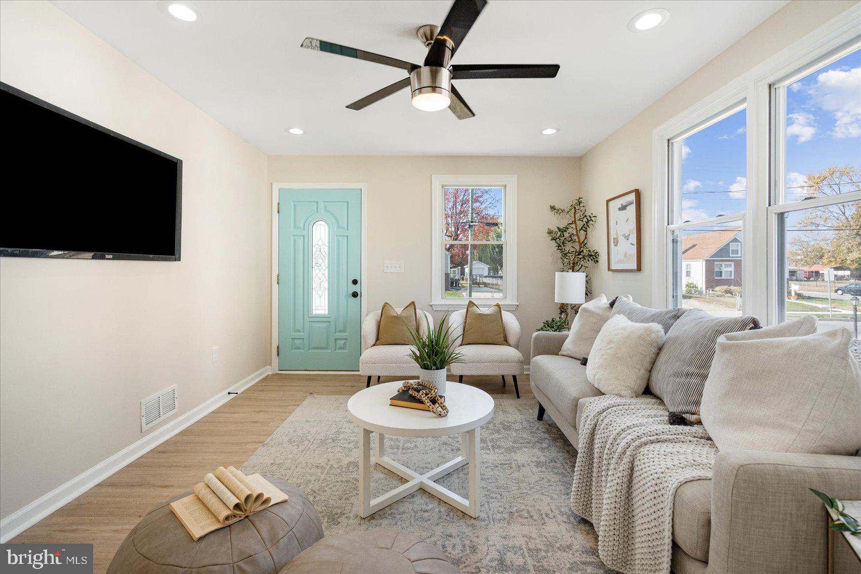 405 Margaret Avenue Baltimore, MD 21221 - Photo 5 of 38 a living room with furniture and a flat screen tv