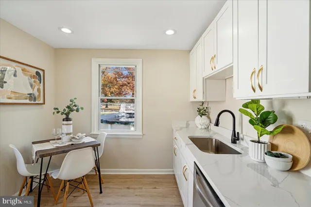 a kitchen with a table and chairs in it