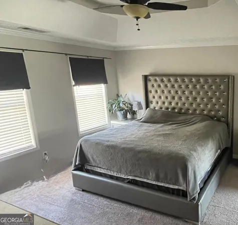 a bedroom with a bed and window