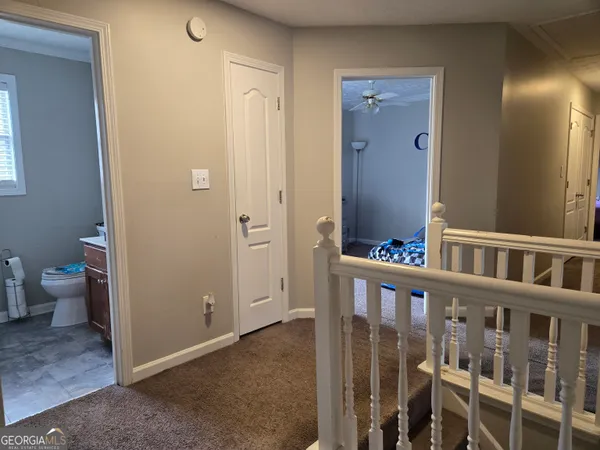 a bedroom with a bed and a tv