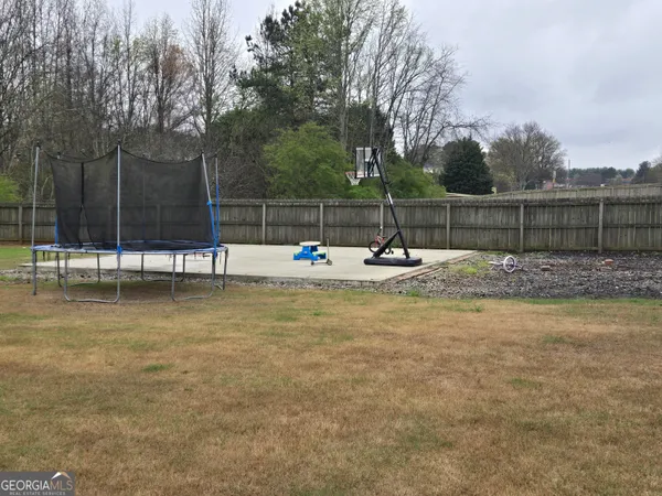 a view of a yard with a tree