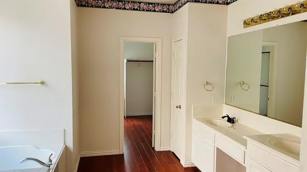 a bathroom with a bathtub and shower
