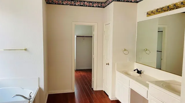 a bathroom with a bathtub and shower