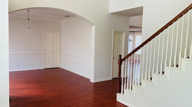 a view of entryway with wooden floor