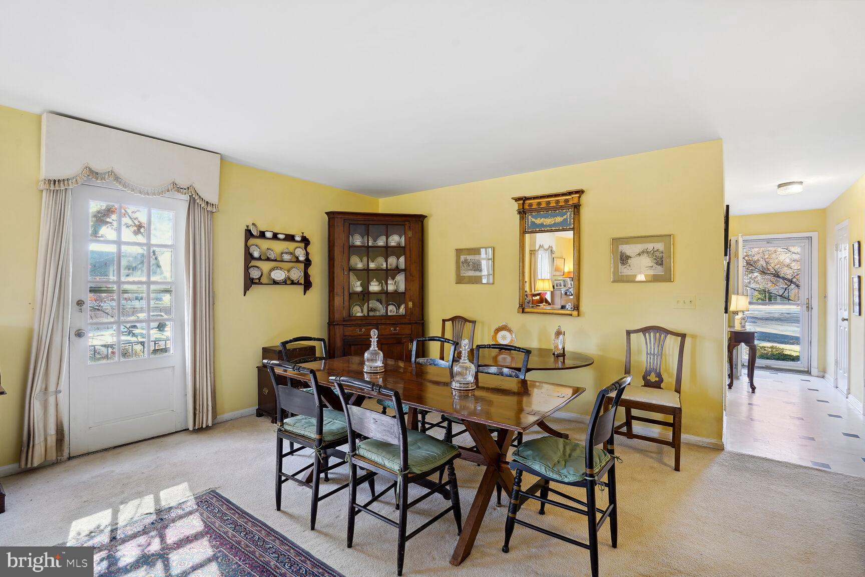 4813 Sangamore Road, Unit 7 Bethesda, MD 20816 - Photo 8 of 21 Door leads to the stone patio and fenced garden
