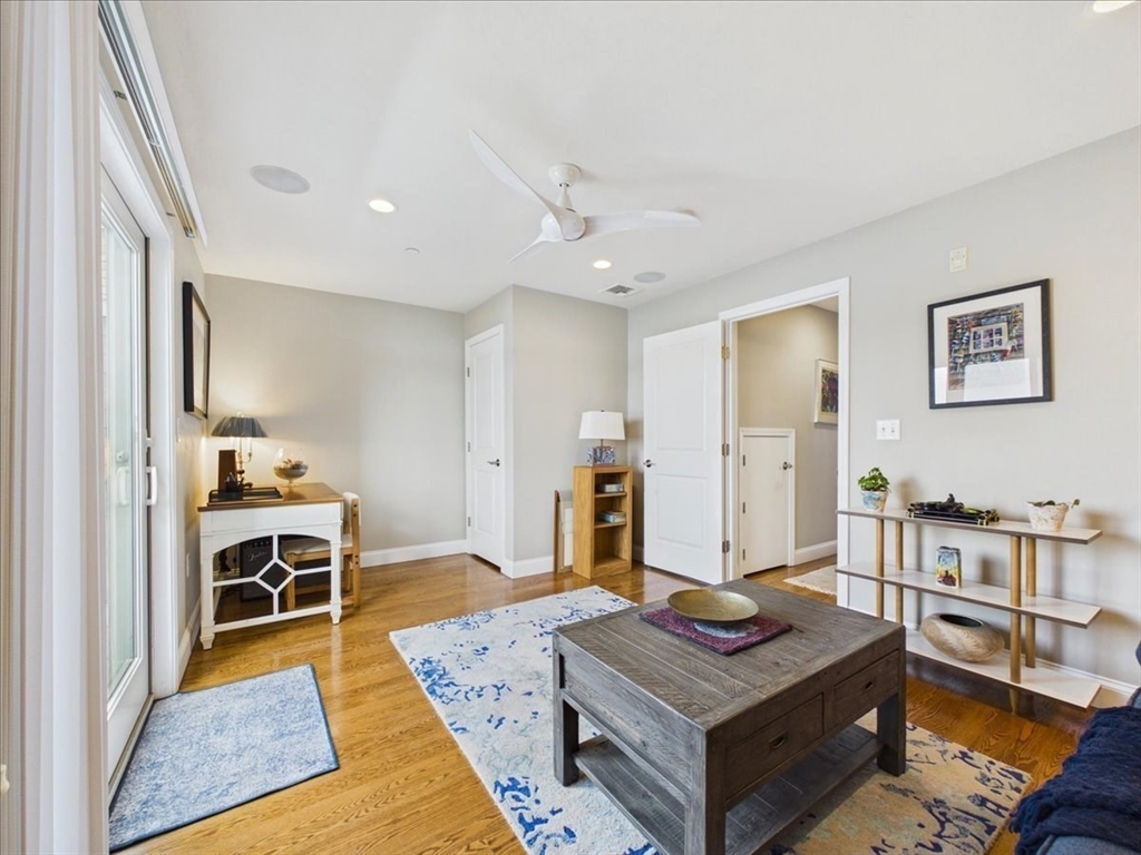 7 Bay Street, Unit 3 Hull, MA 02045 - Photo 18 of 40 a living room with furniture and a table