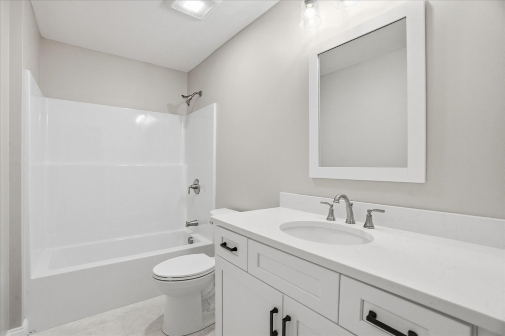 519 Mendon Road, Unit 519 Attleboro, MA 02703 - Photo 15 of 22 a bathroom with a sink a toilet and shower