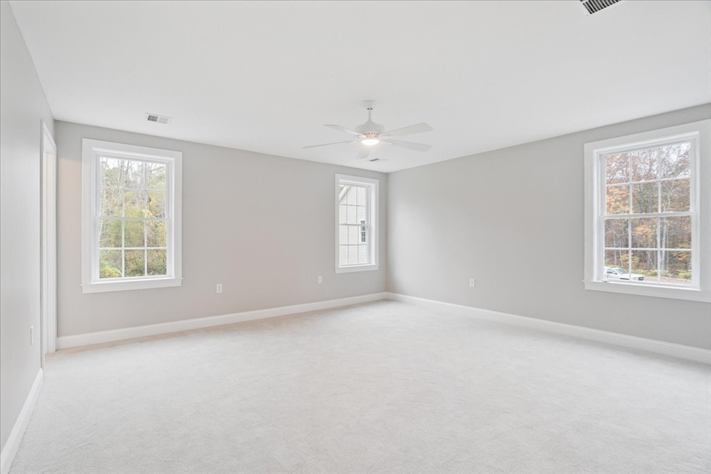 519 Mendon Road, Unit 519 Attleboro, MA 02703 - Photo 16 of 22 an empty room with windows and closet