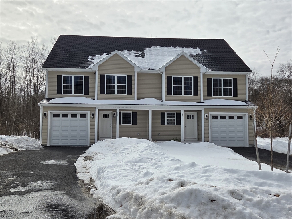 519 Mendon Road, Unit 519 Attleboro, MA 02703 - Photo 2 of 22 a view of a white house with large windows