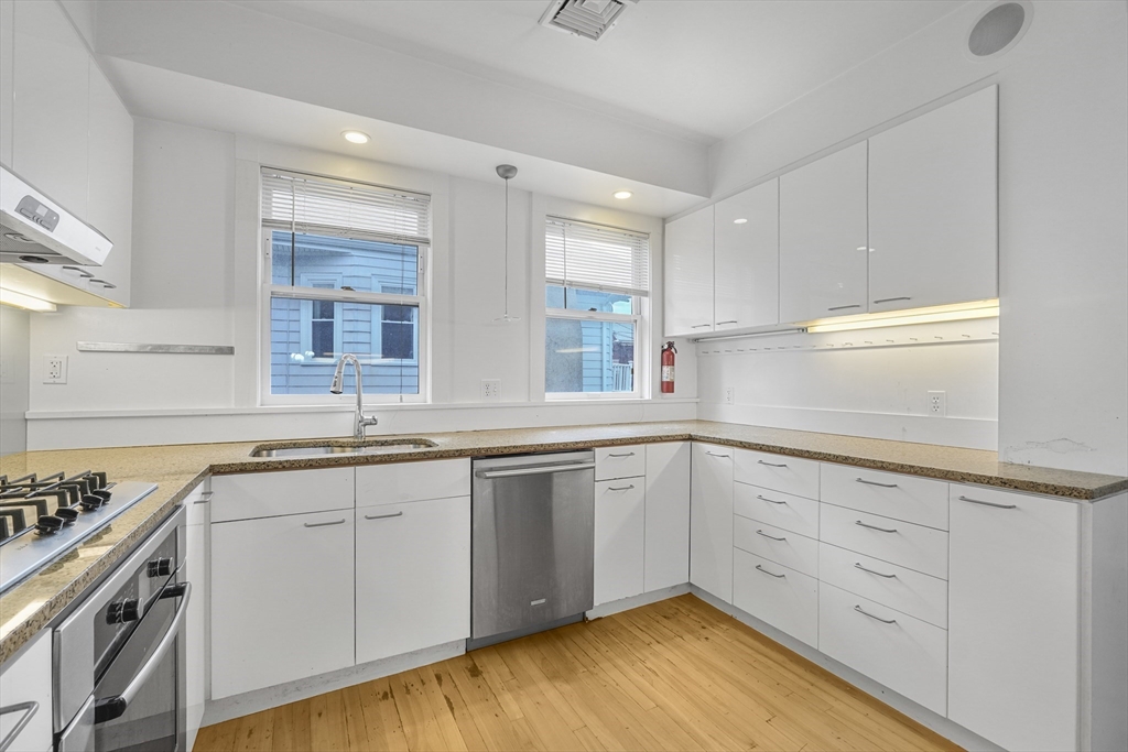 172 Maplewood Street Watertown, MA 02472 - Photo 1 of 42 a kitchen with sink cabinets and window