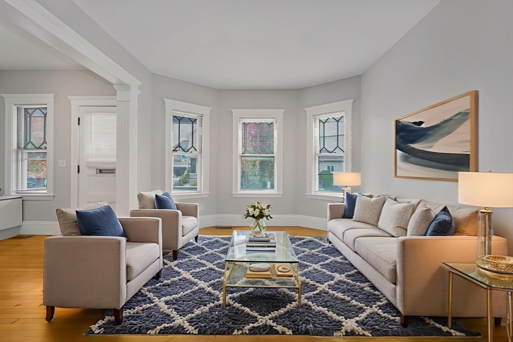 172 Maplewood Street Watertown, MA 02472 - Photo 22 of 42 a living room with furniture and a rug