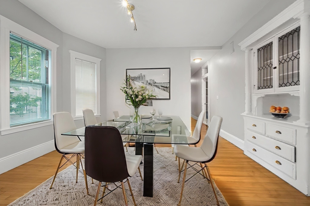 172 Maplewood Street Watertown, MA 02472 - Photo 23 of 42 a view of a dining room with furniture and a window