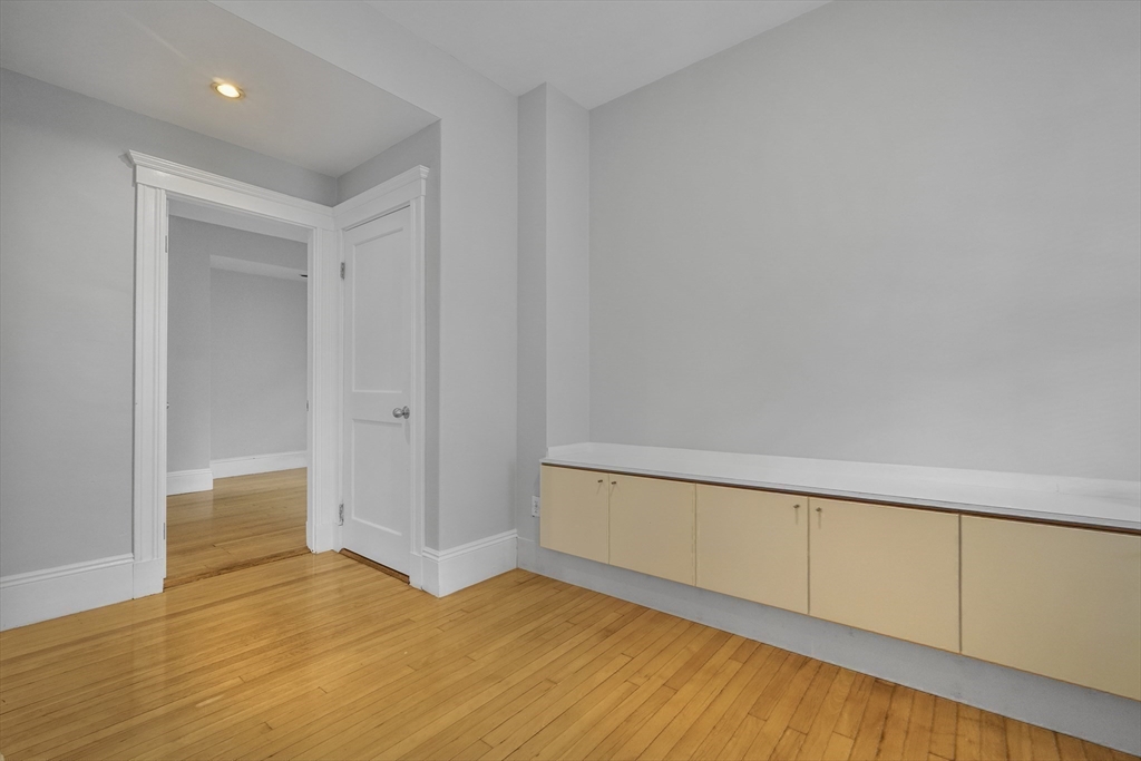 172 Maplewood Street Watertown, MA 02472 - Photo 24 of 42 a view of an empty room with wooden floor