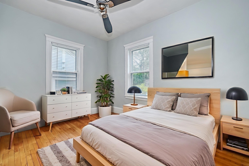 172 Maplewood Street Watertown, MA 02472 - Photo 26 of 42 a bedroom with a bed and a chair
