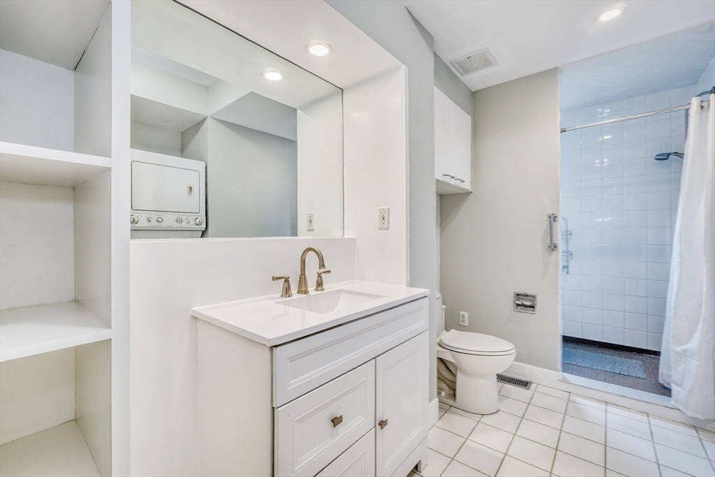 172 Maplewood Street Watertown, MA 02472 - Photo 28 of 42 a bathroom with a sink toilet and shower