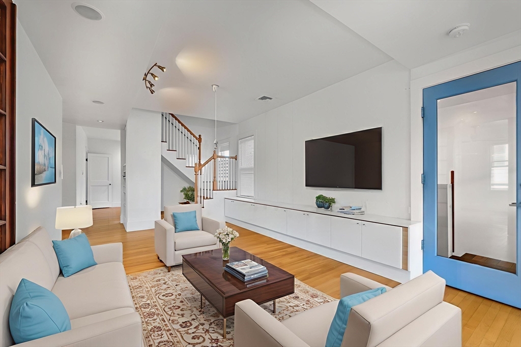 172 Maplewood Street Watertown, MA 02472 - Photo 4 of 42 a living room with furniture and a flat screen tv