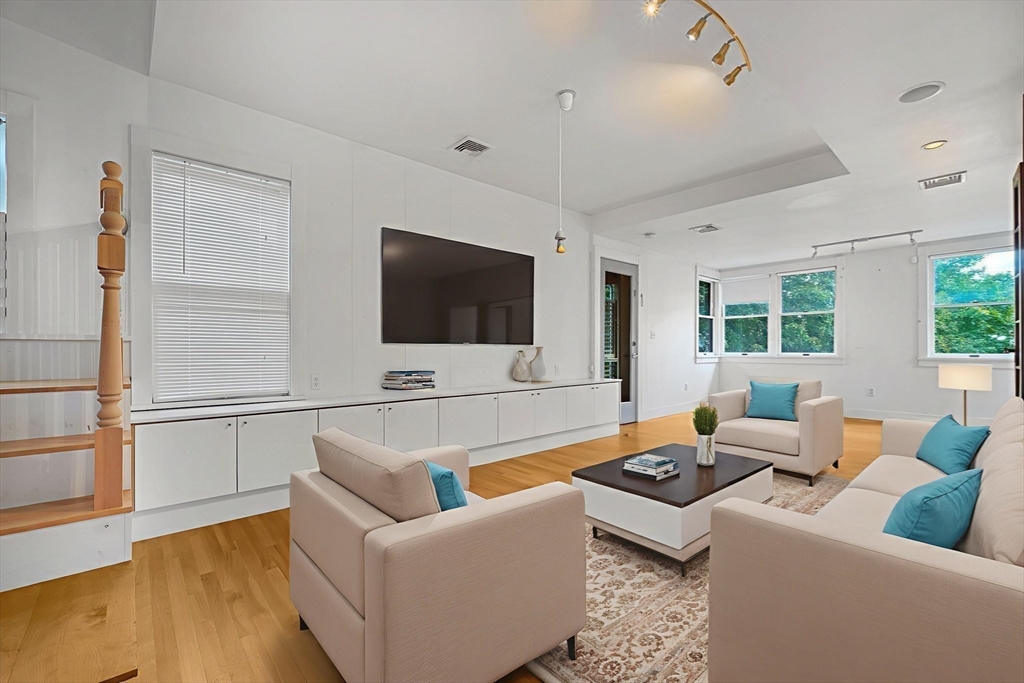 172 Maplewood Street Watertown, MA 02472 - Photo 5 of 42 a living room with furniture and a flat screen tv