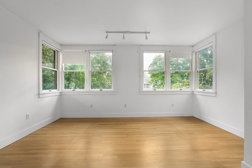 172 Maplewood Street Watertown, MA 02472 - Photo 7 of 42 an empty room with windows