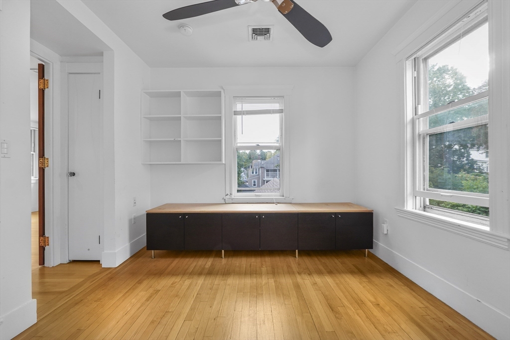 172 Maplewood Street Watertown, MA 02472 - Photo 9 of 42 a room with a bed and window
