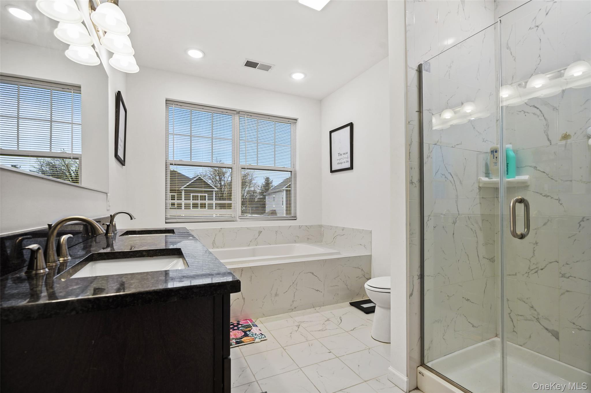 28 Magnolia Pk Road Middletown, NY 10940 - Photo 16 of 25 a bathroom with a sink a large mirror and shower