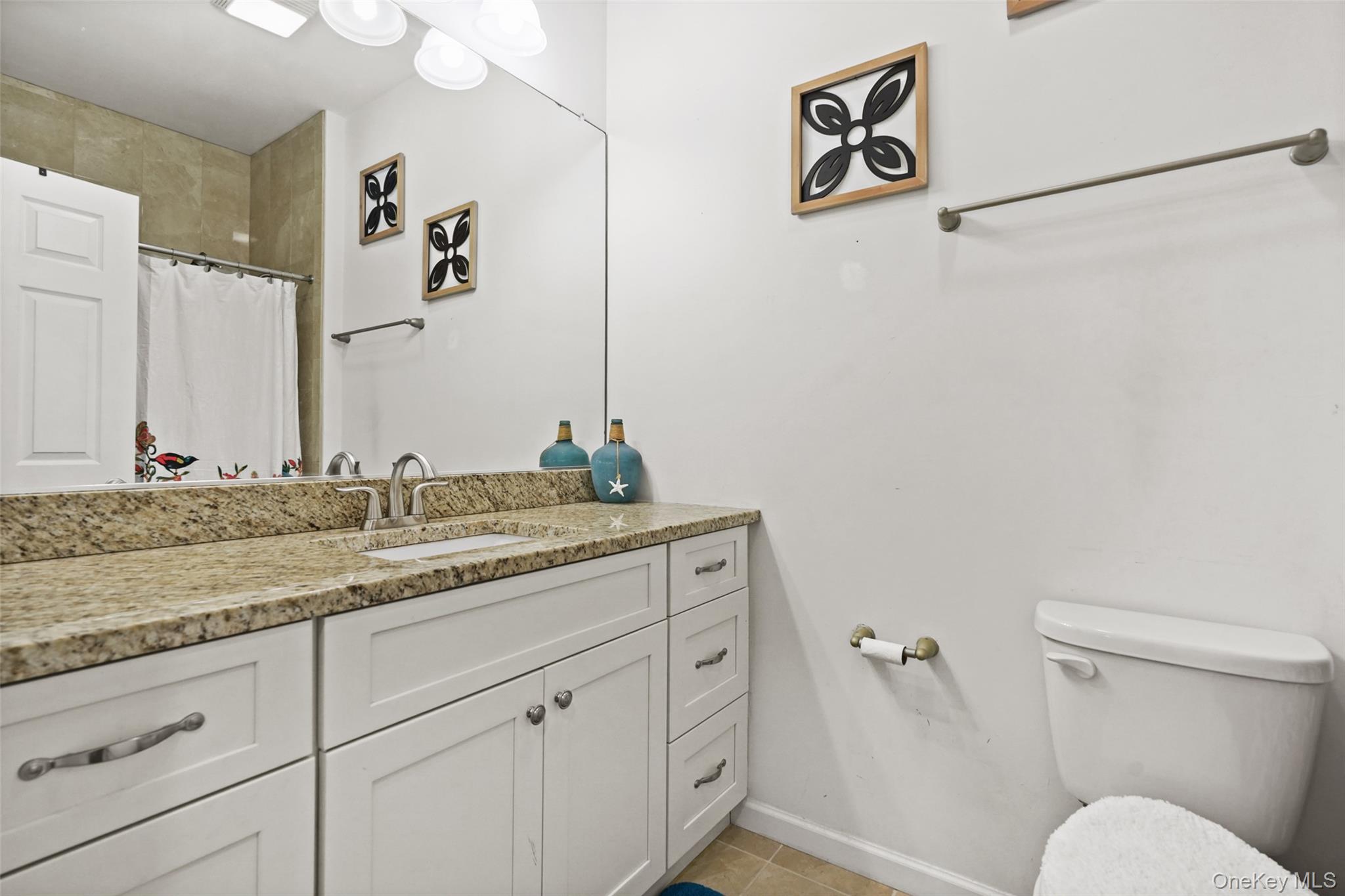 28 Magnolia Pk Road Middletown, NY 10940 - Photo 19 of 25 a bathroom with a granite countertop sink and a mirror