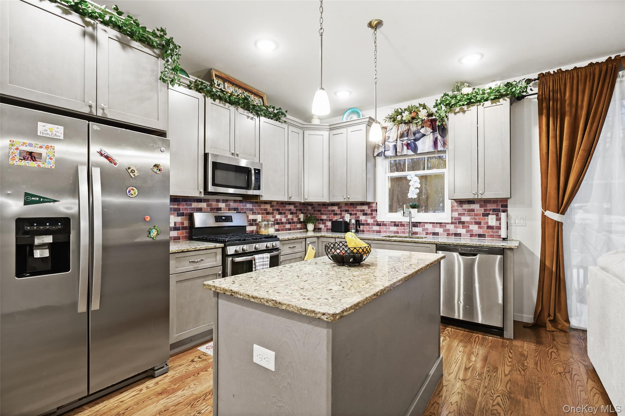 28 Magnolia Pk Road Middletown, NY 10940 - Photo 2 of 25 a kitchen with stainless steel appliances granite countertop a sink a stove and a refrigerator