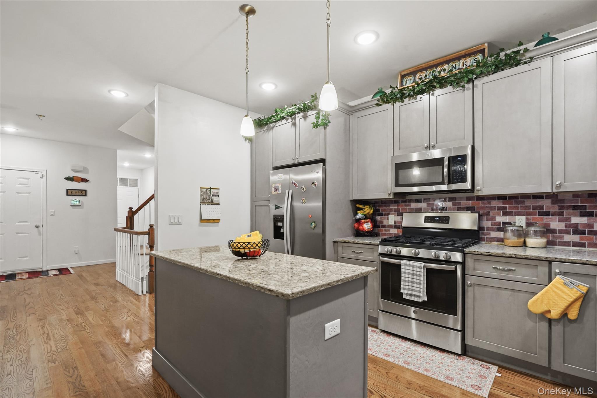 28 Magnolia Pk Road Middletown, NY 10940 - Photo 4 of 25 a kitchen with stainless steel appliances granite countertop a sink a stove and a refrigerator