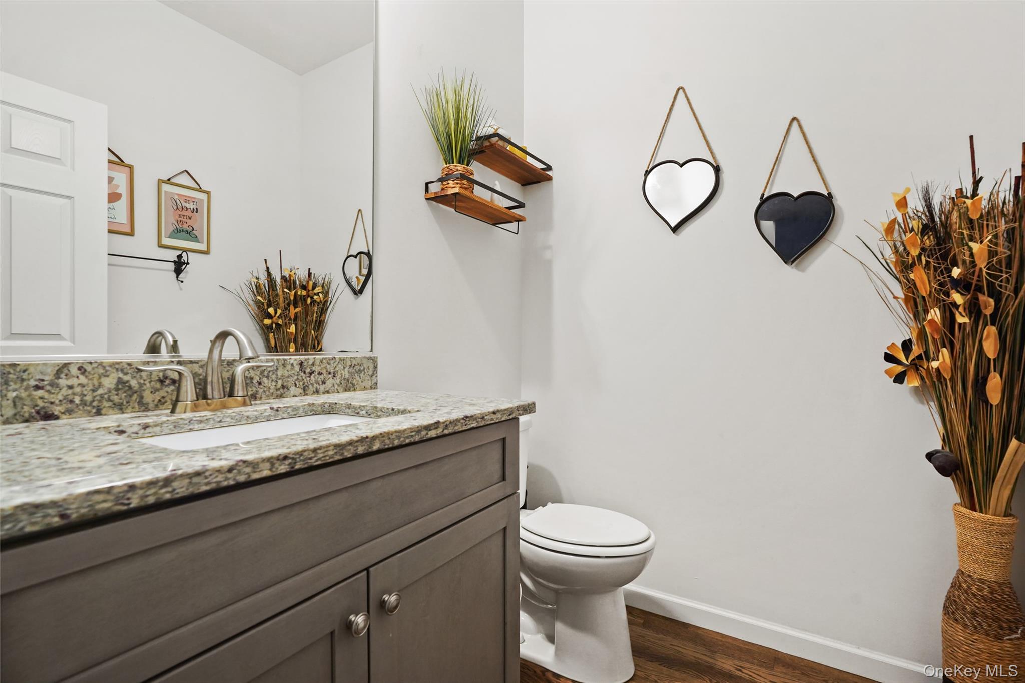 28 Magnolia Pk Road Middletown, NY 10940 - Photo 10 of 25 a bathroom with a granite countertop sink a toilet and mirror