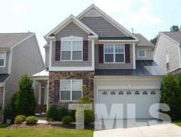 8423 Header Stone Drive Raleigh, NC 27613 - Photo 1 of 14 a front view of a house with garden