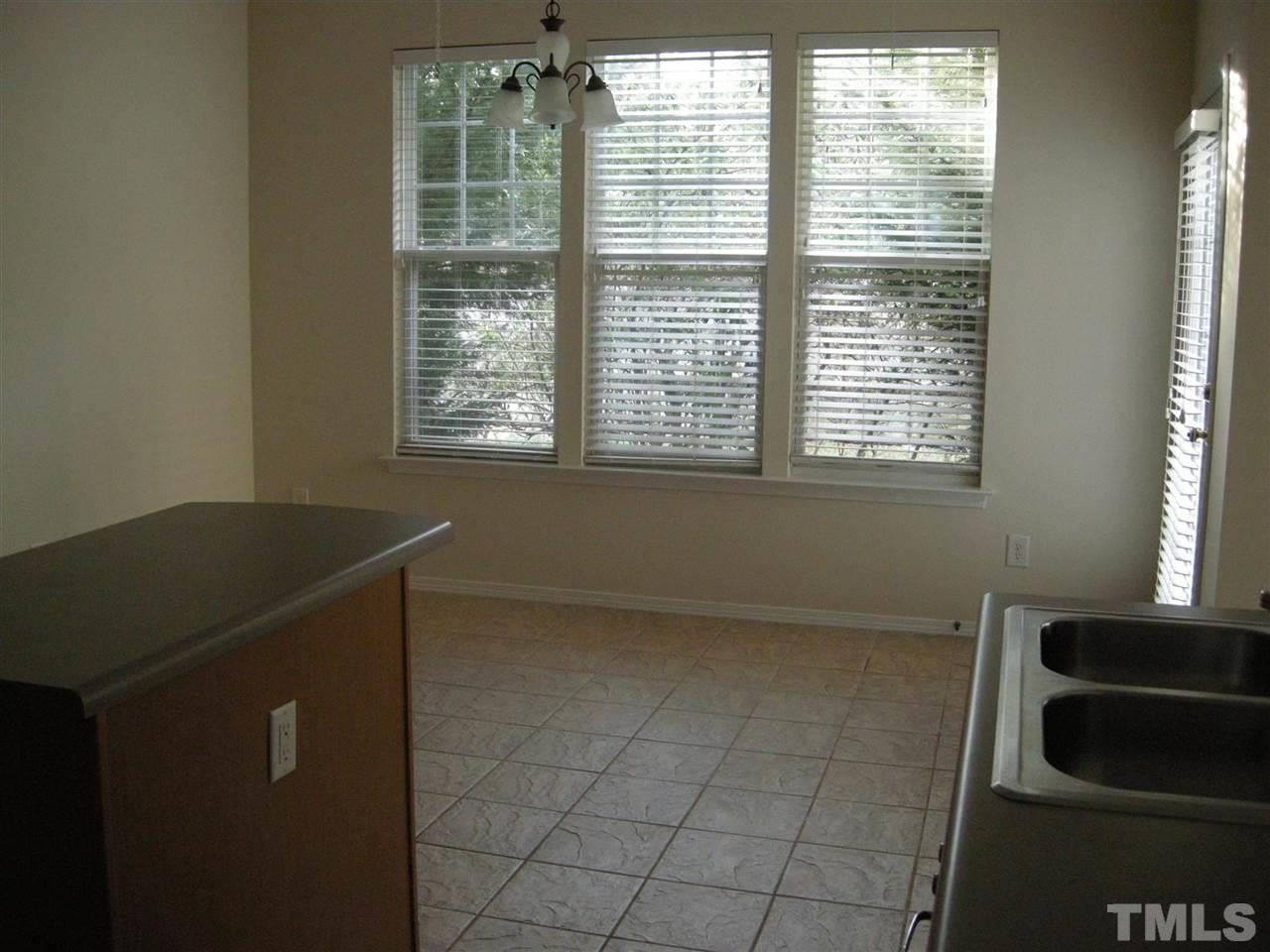 8423 Header Stone Drive Raleigh, NC 27613 - Photo 4 of 14 a view of an empty room with a window