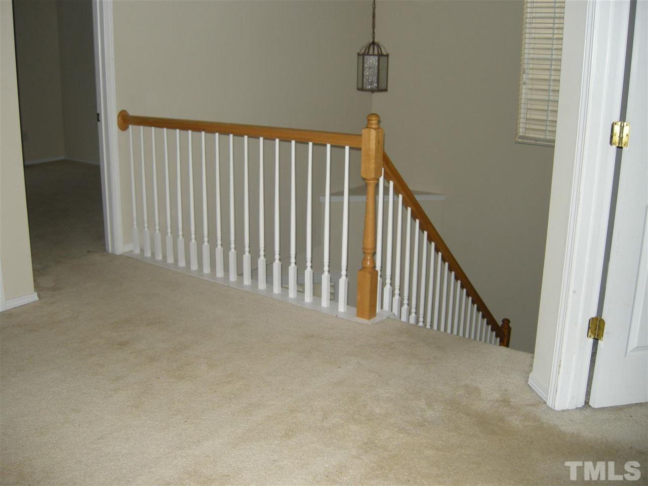 8423 Header Stone Drive Raleigh, NC 27613 - Photo 8 of 14 a view of a hallway