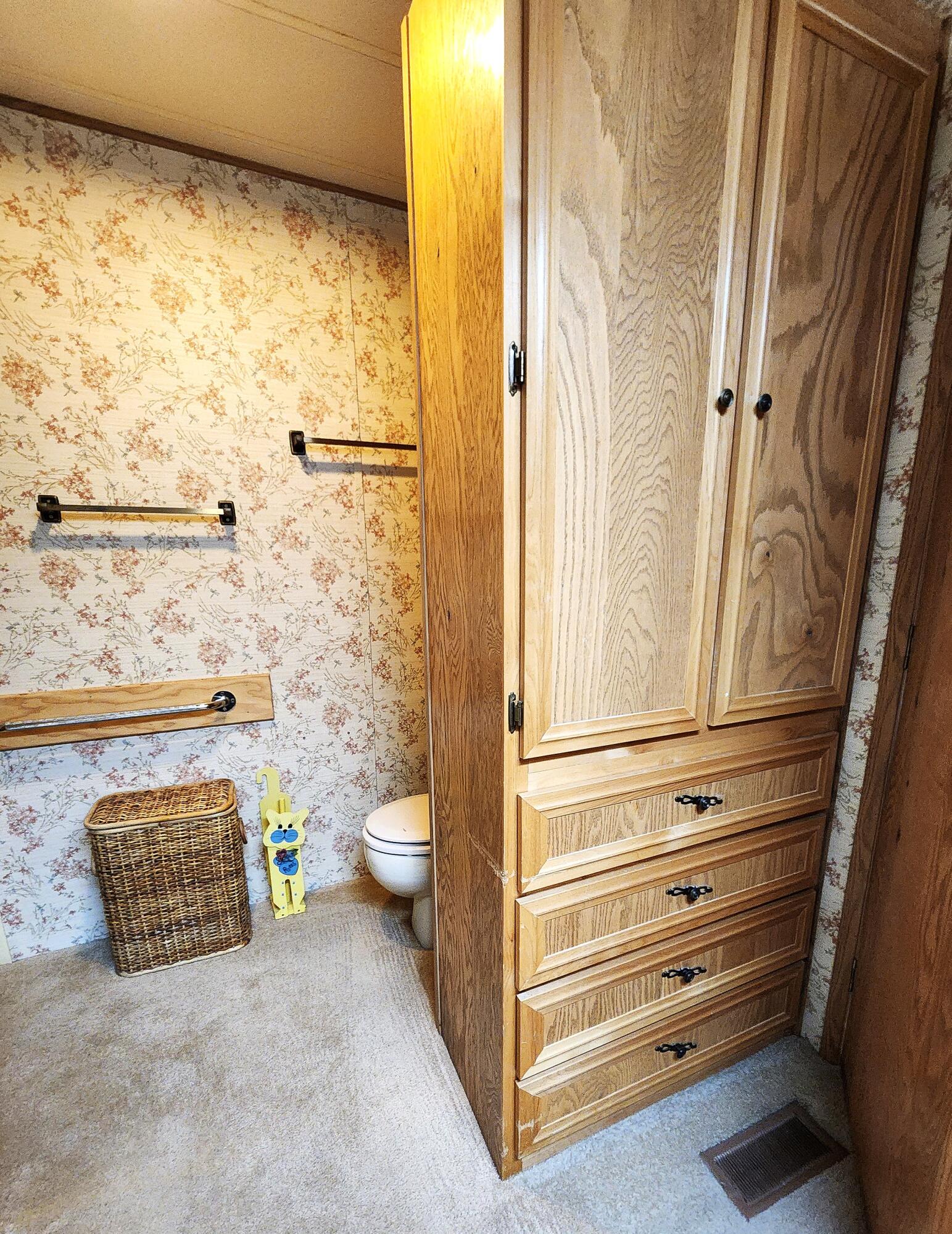 1001 Southeast 15th Street, Unit 34 Bend, OR 97702 - Photo 23 of 43 Great storage cabinet and drawers behind door in Primary bathroom