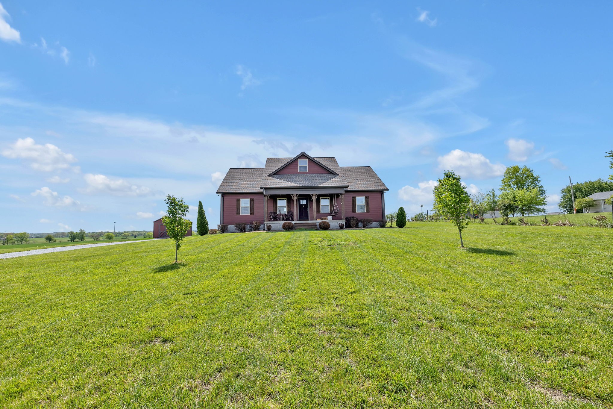 8087 Dunn Road Cedar Hill, TN 37032 - Photo 1 of 33 a front view of a house with garden
