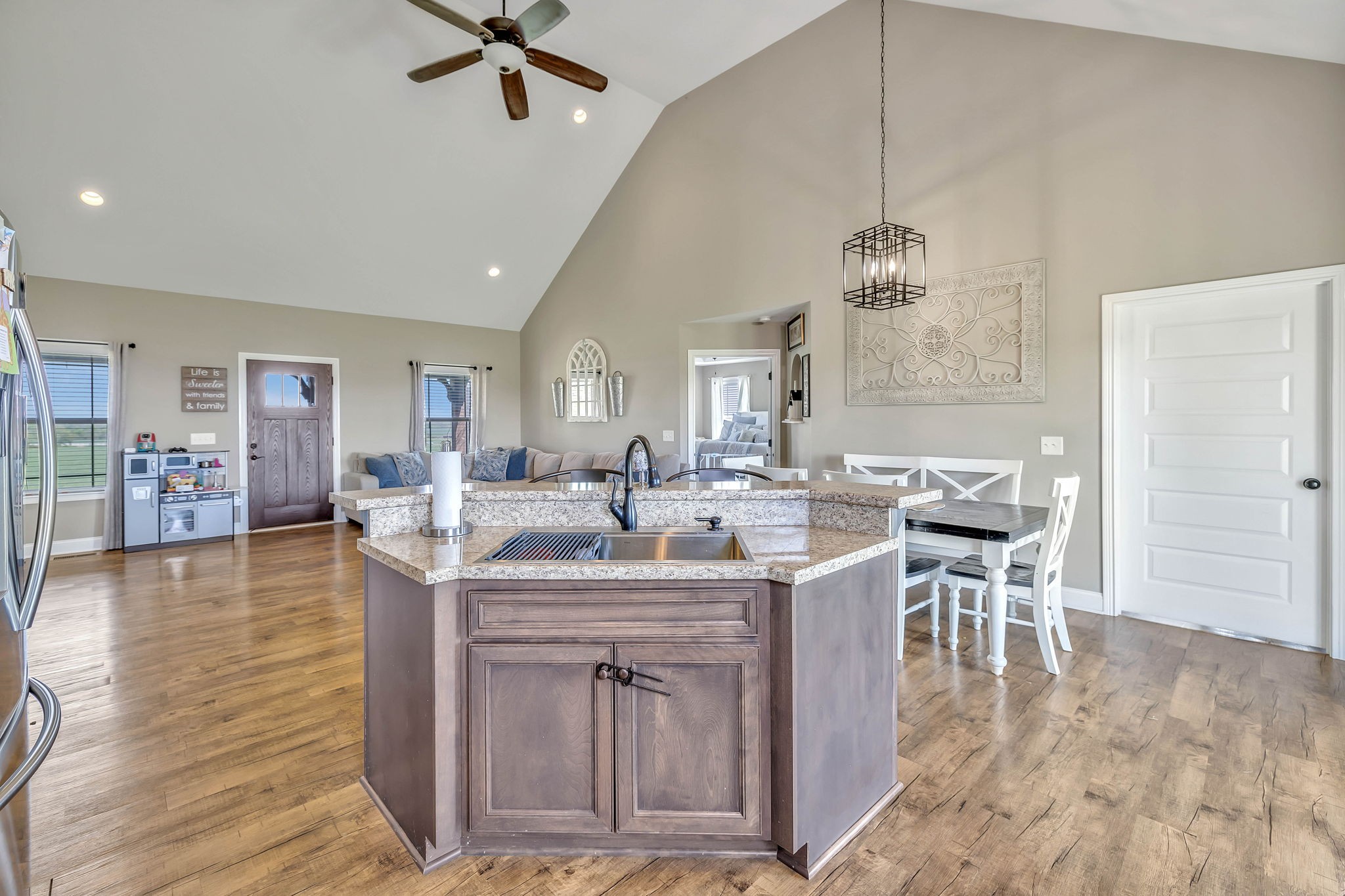 8087 Dunn Road Cedar Hill, TN 37032 - Photo 12 of 33 a kitchen with center island table and chairs in it