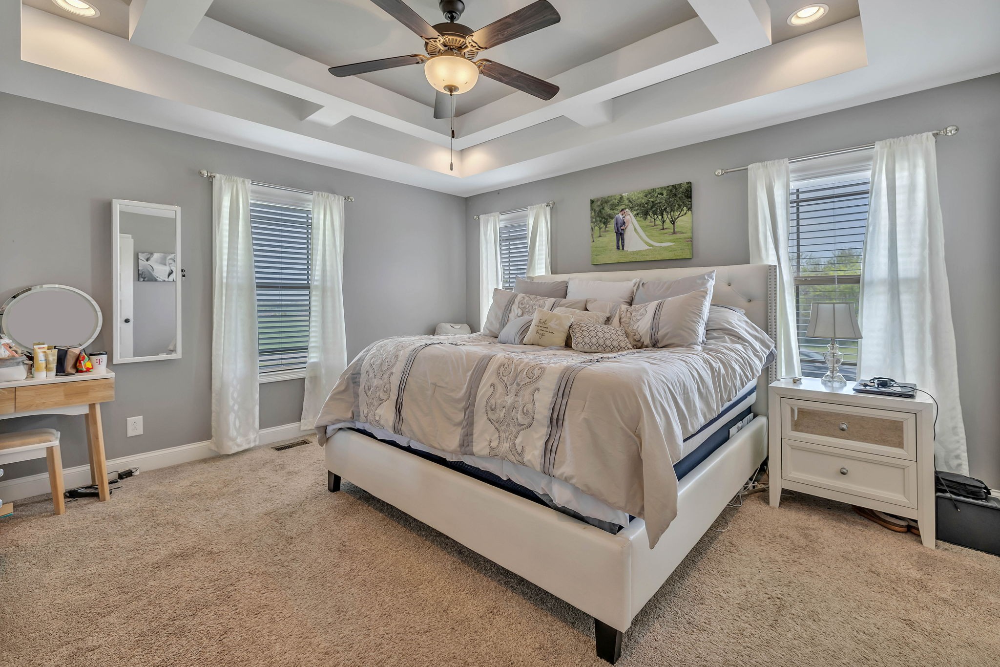 8087 Dunn Road Cedar Hill, TN 37032 - Photo 15 of 33 a bedroom with a bed and a chandelier