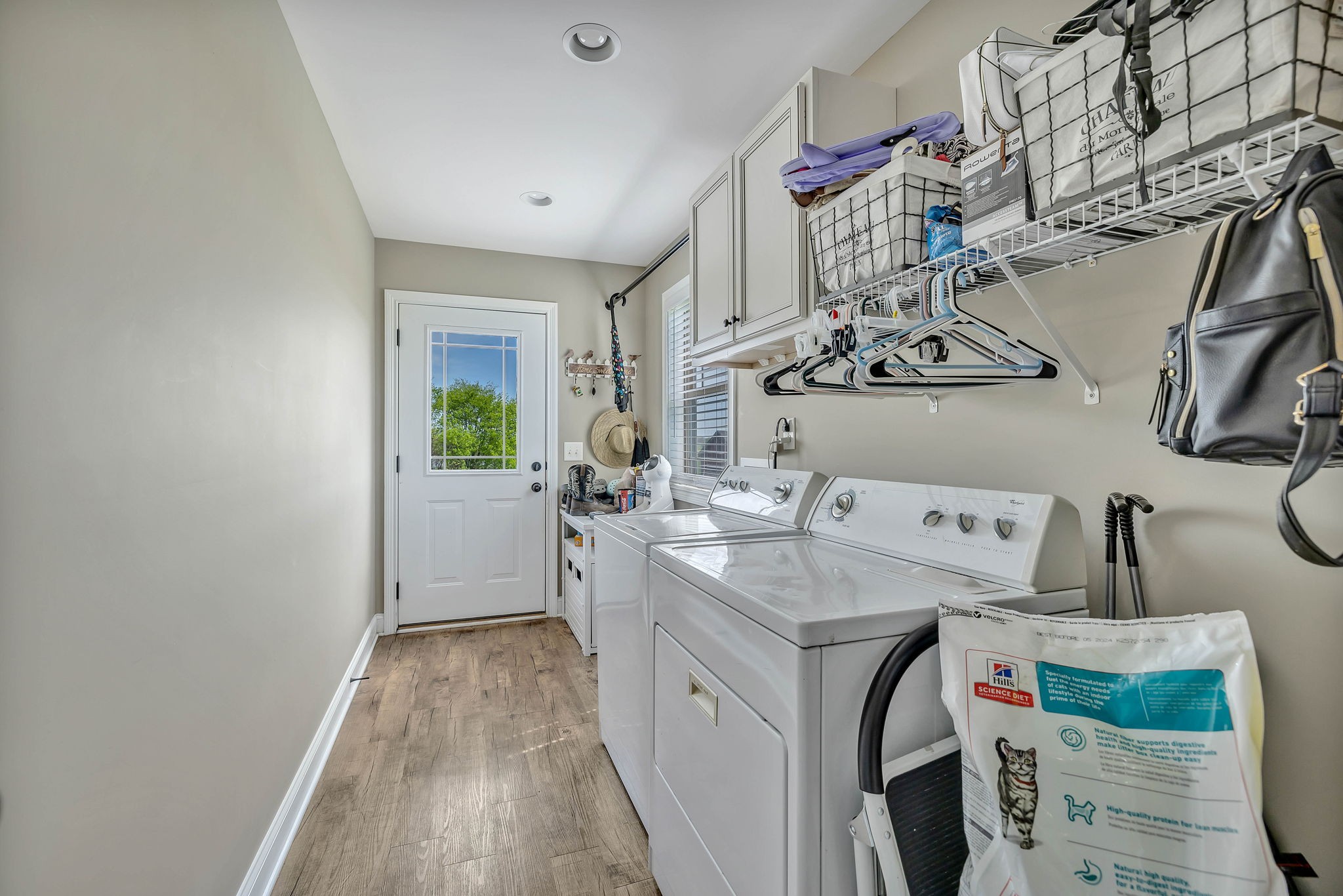 8087 Dunn Road Cedar Hill, TN 37032 - Photo 22 of 33 a utility room with cabinets washer and dryer