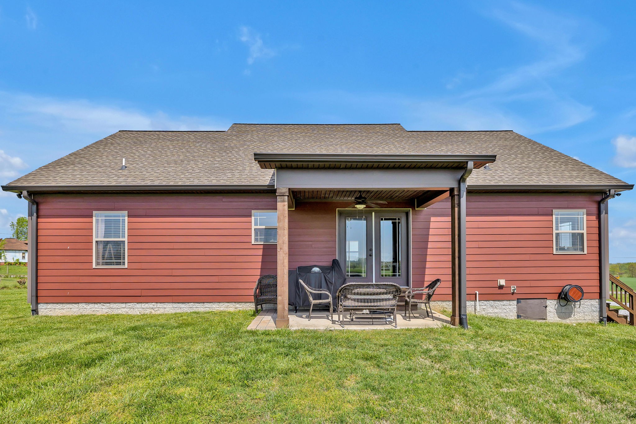 8087 Dunn Road Cedar Hill, TN 37032 - Photo 23 of 33 a backyard of a house with table and chairs