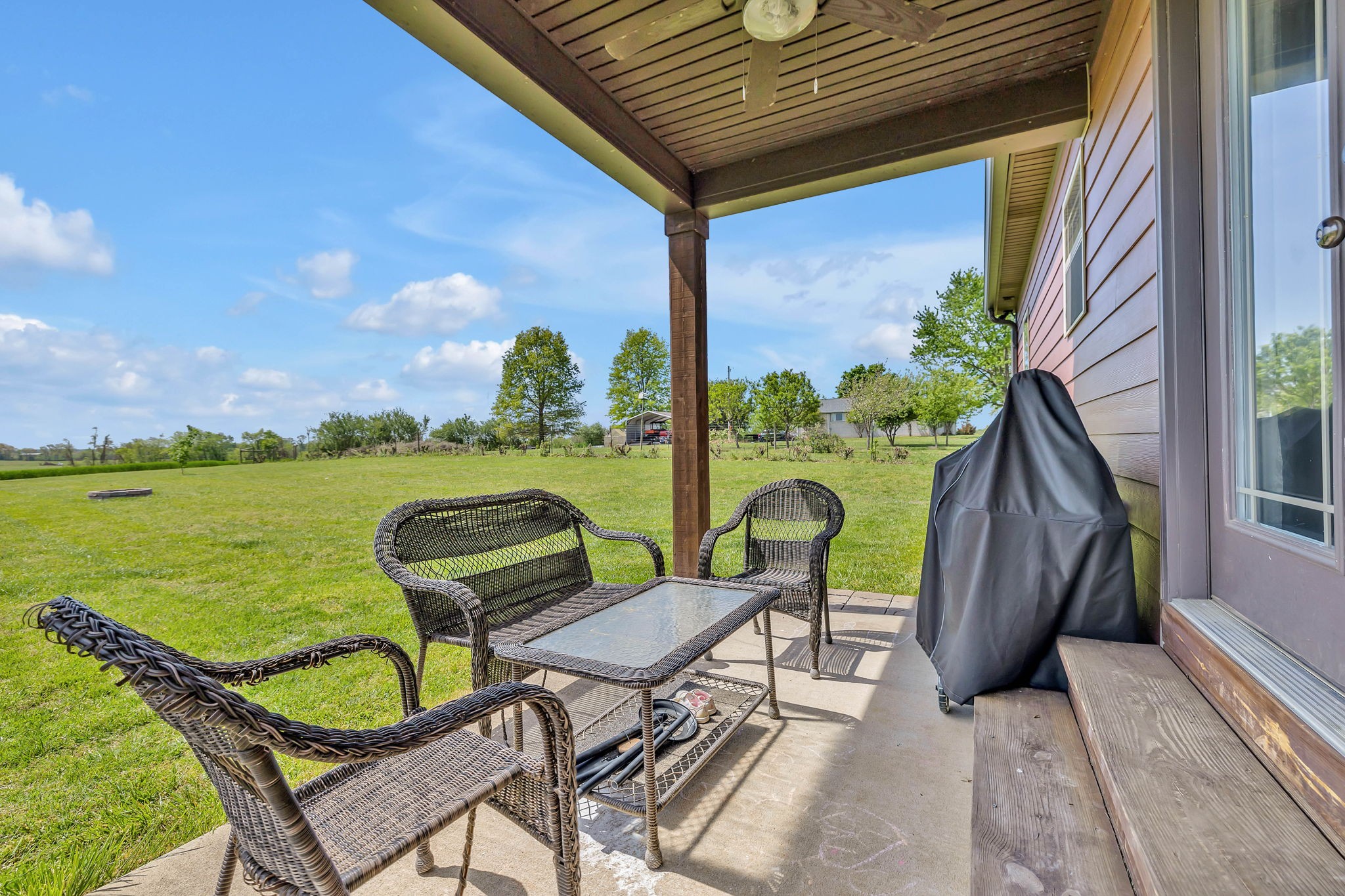 8087 Dunn Road Cedar Hill, TN 37032 - Photo 24 of 33 a view of a chairs and table in patio with a lake view