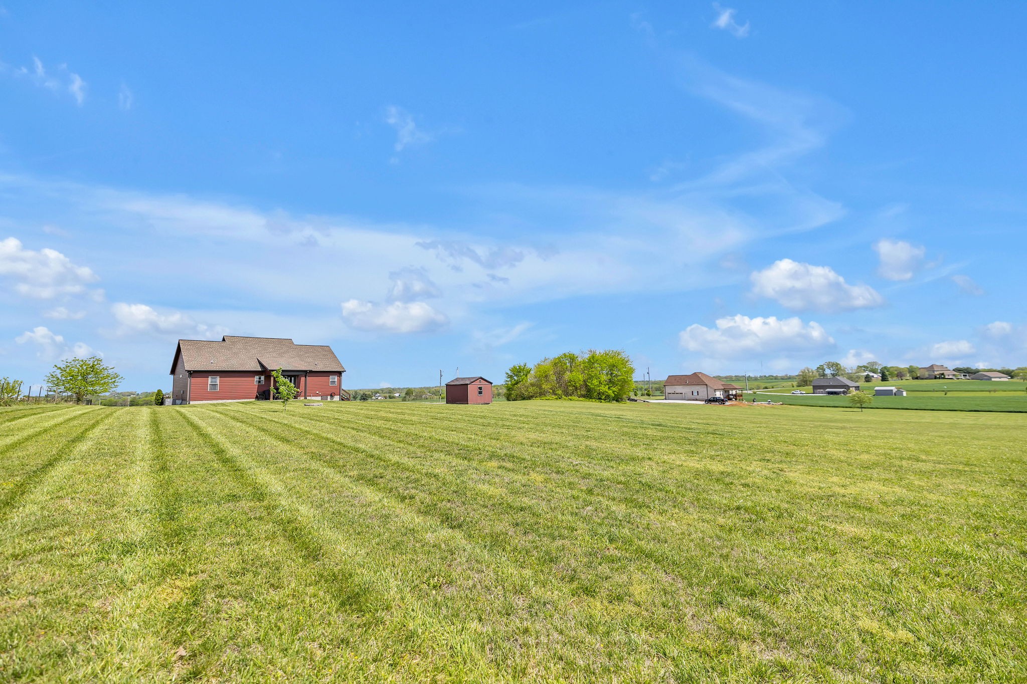 8087 Dunn Road Cedar Hill, TN 37032 - Photo 28 of 33 a yard with lots of trees in the background