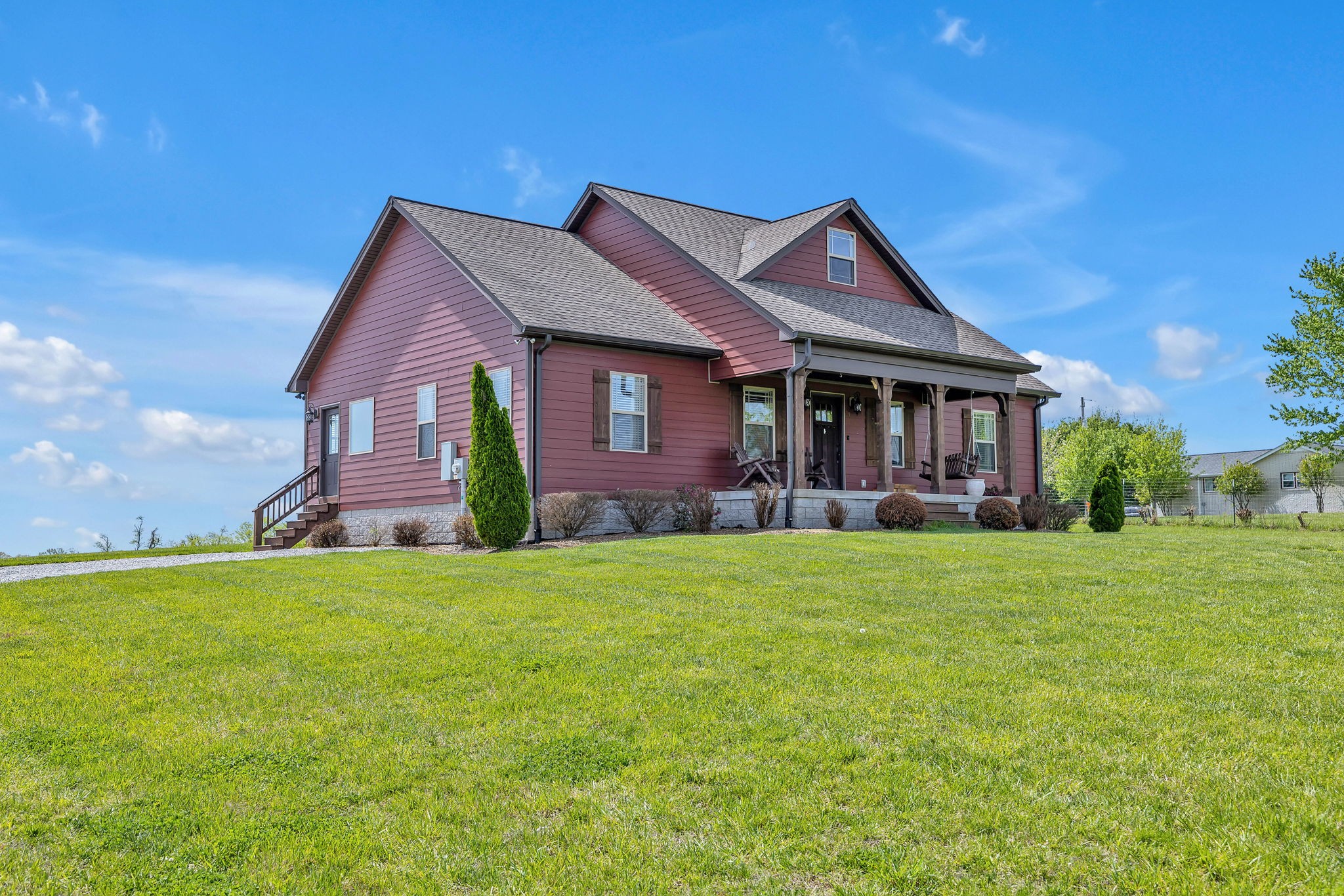8087 Dunn Road Cedar Hill, TN 37032 - Photo 3 of 33 a front view of a house with garden