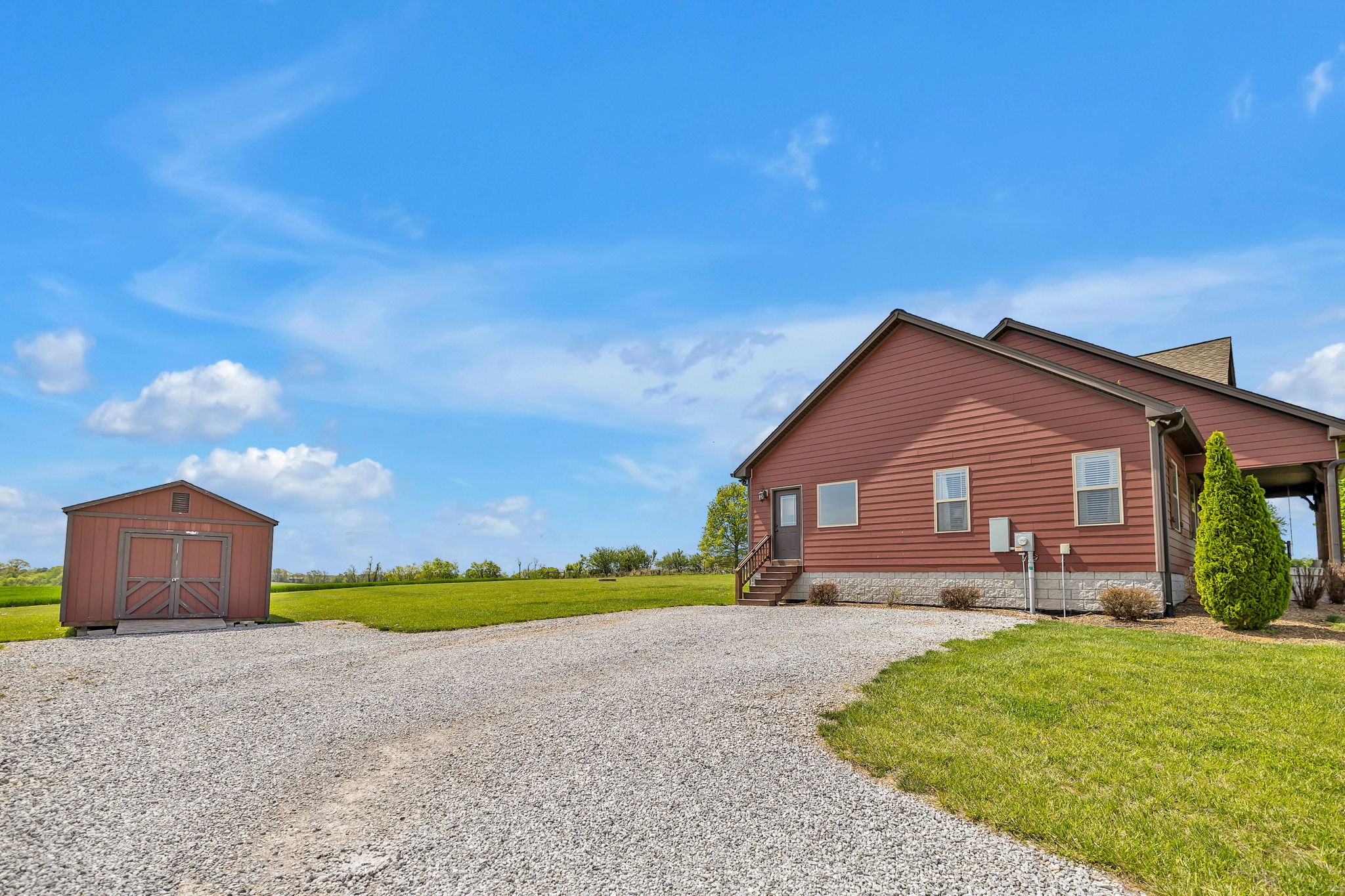 8087 Dunn Road Cedar Hill, TN 37032 - Photo 33 of 33 a front view of a house with a yard and garage
