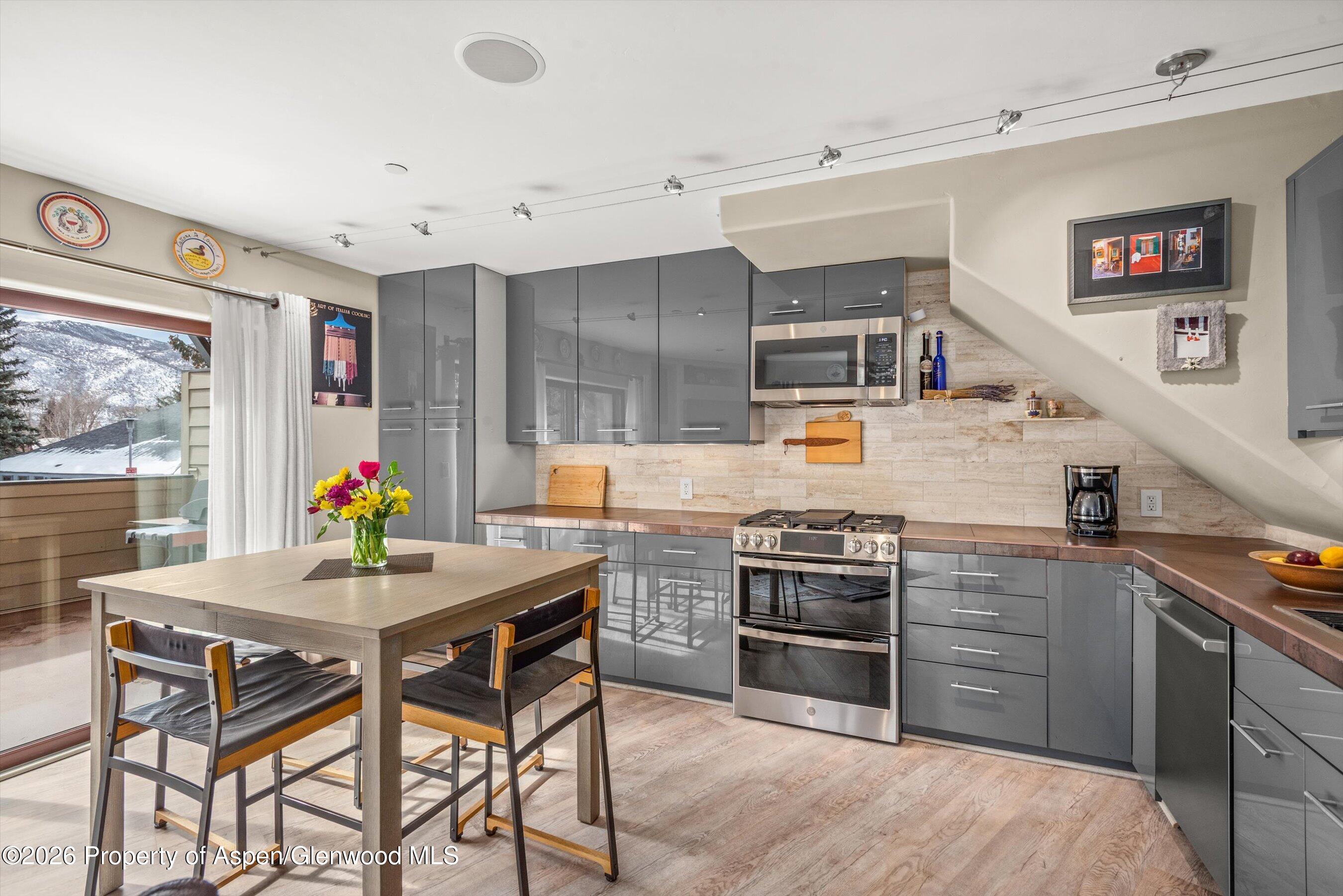 100 Midland Avenue, Unit 104 Basalt, CO 81621 - Photo 8 of 18 KITCHEN WITH DINING TABLE